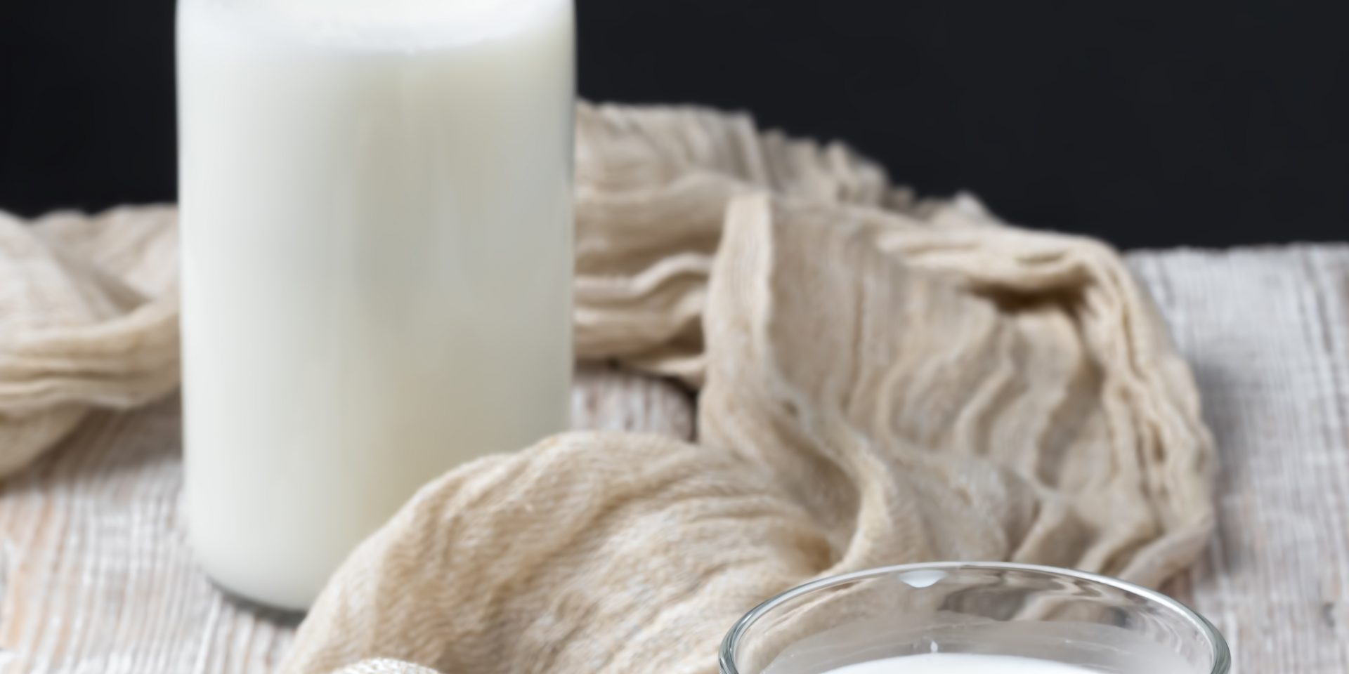 Glass With Milk Close-up On A Wooden Vintage Surface. Bottle Of